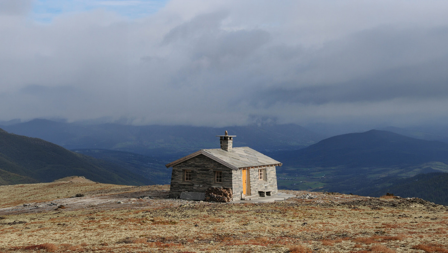Natural stone cabin shaped by the Norwegian mountains